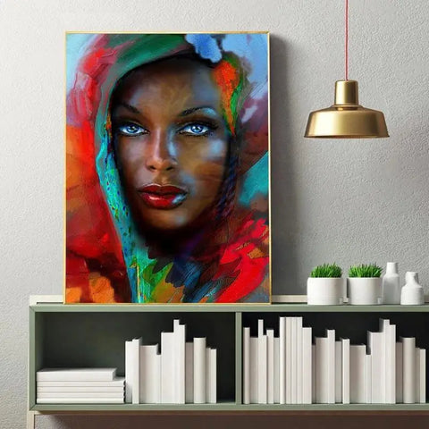tableau afrique la femme au yeux bleus portrait abstrait vibrant sur toile avec femme aux yeux bleus perçants et lèvres rouges audacieuses encadré en or