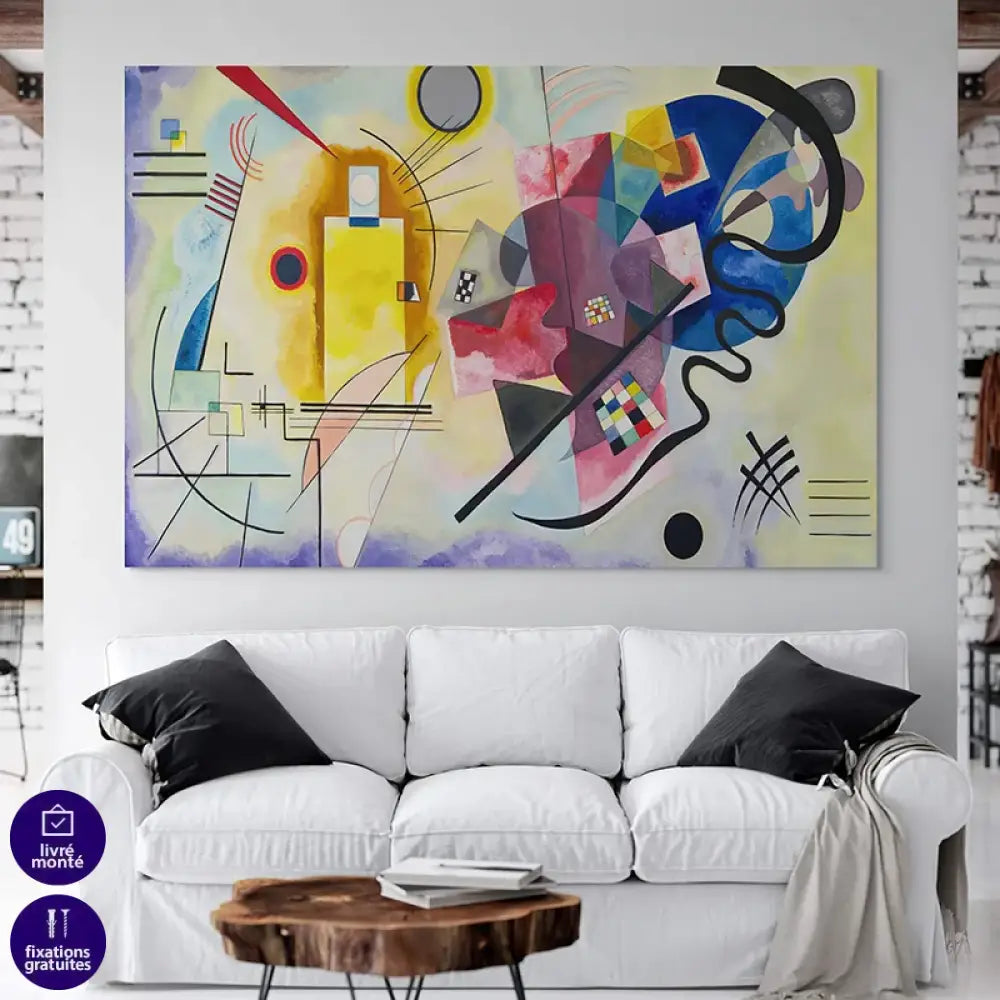 Tableau Kandinsky Jaune Rouge Bleu accroché au-dessus d’un canapé clair