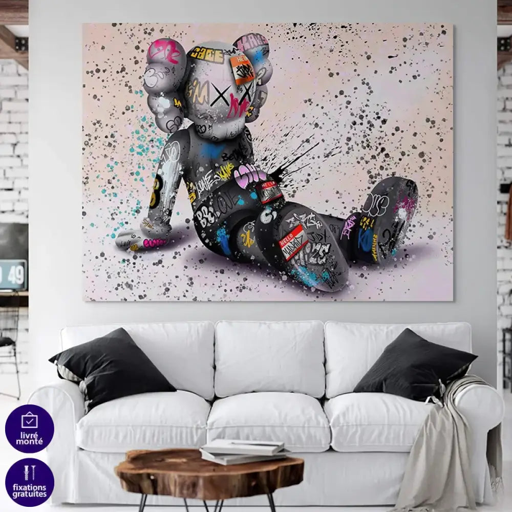 tableau kaws le rêveur assis street art personnage assis tags et éclaboussures