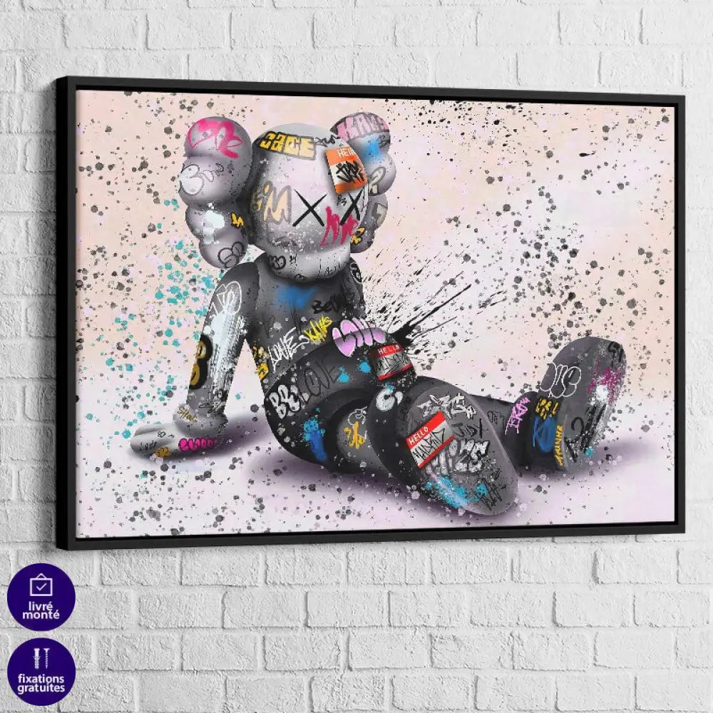 tableau kaws le rêveur assis avec cadre noir 